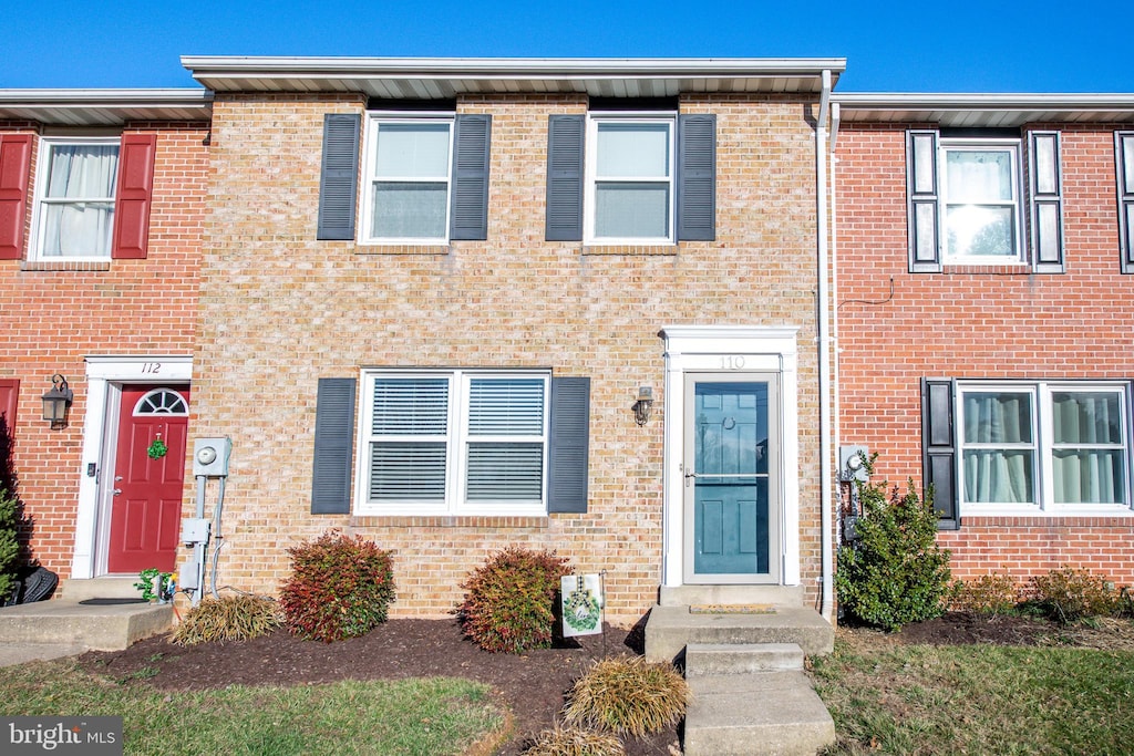 multi unit property featuring brick siding