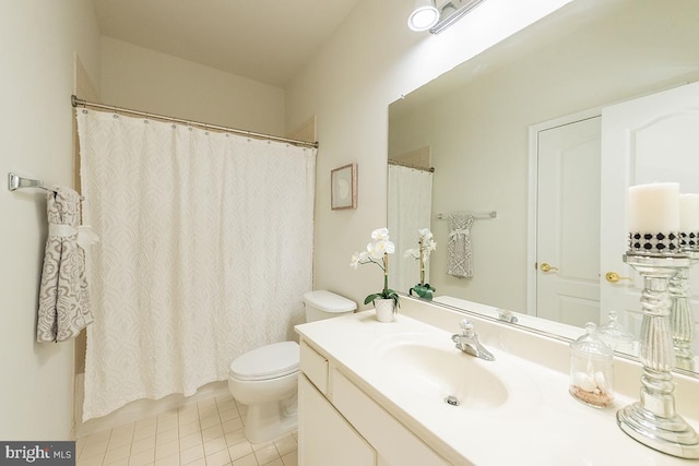 bathroom with a shower with shower curtain, tile patterned flooring, vanity, and toilet