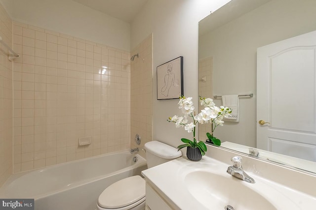 full bath featuring toilet, washtub / shower combination, and vanity