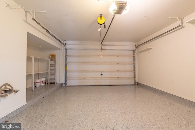 garage featuring baseboards and a garage door opener