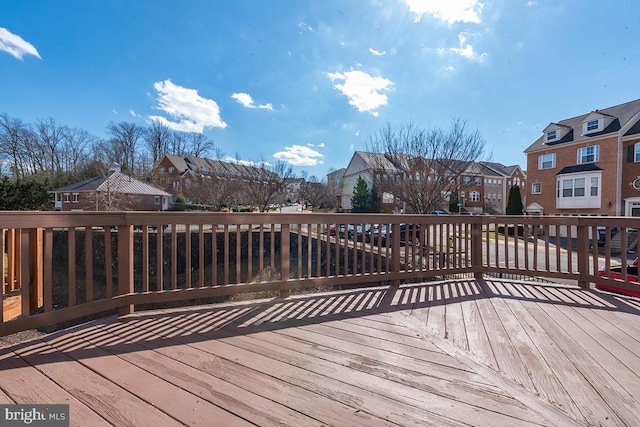 wooden terrace with a residential view