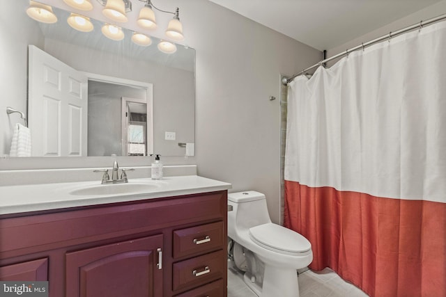 bathroom featuring tile patterned floors, a shower with shower curtain, toilet, and vanity