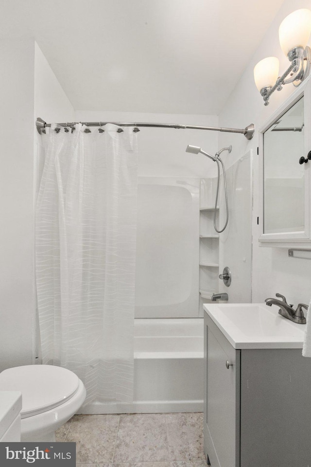 full bath featuring vanity, tile patterned floors, toilet, and shower / bathtub combination with curtain