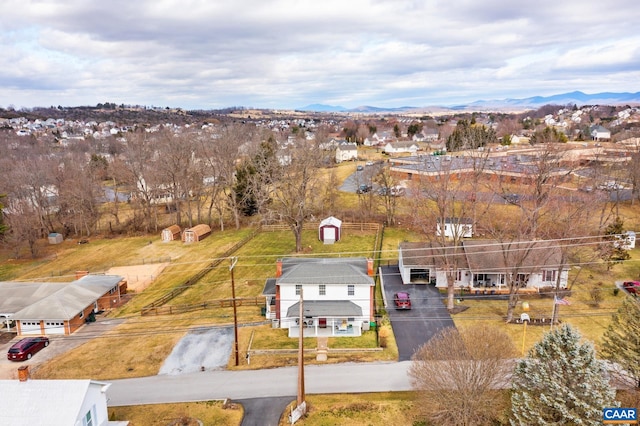 birds eye view of property with a mountain view