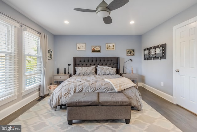 bedroom featuring ceiling fan, baseboards, wood finished floors, and recessed lighting