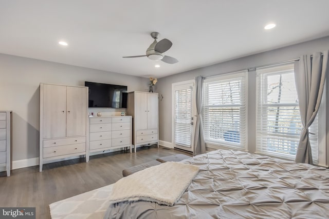 bedroom featuring a ceiling fan, baseboards, wood finished floors, and recessed lighting