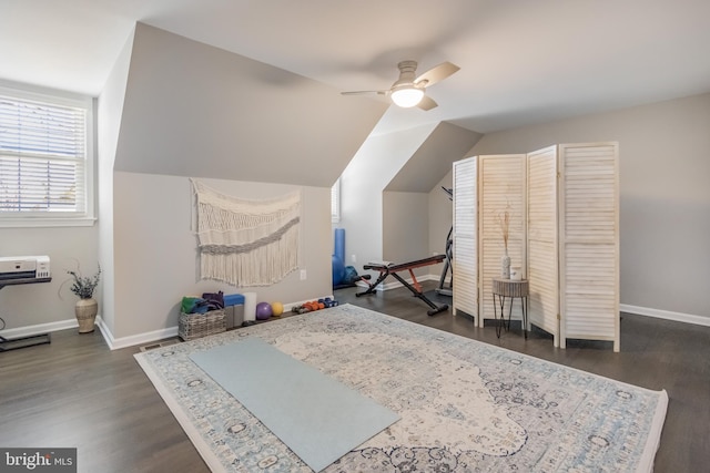 bonus room featuring vaulted ceiling, dark wood finished floors, baseboards, and ceiling fan