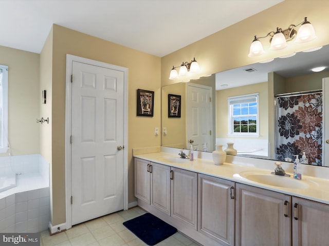 full bath with a garden tub, double vanity, a sink, and visible vents