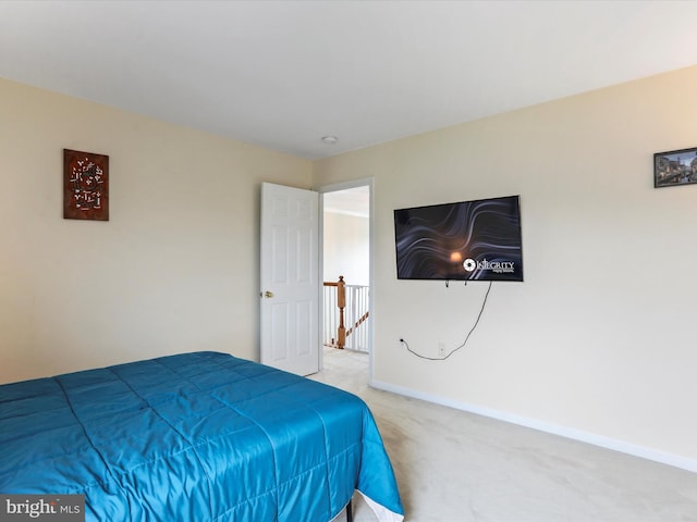 bedroom featuring carpet flooring and baseboards