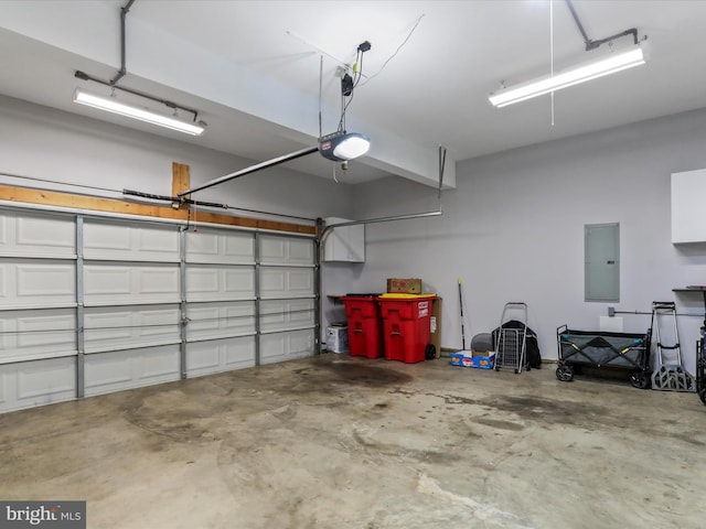 garage featuring electric panel and a garage door opener