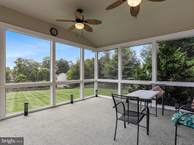 sunroom / solarium featuring lofted ceiling