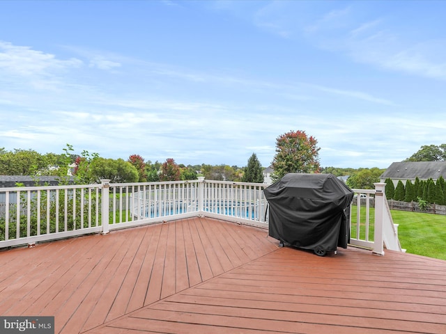 wooden deck with grilling area