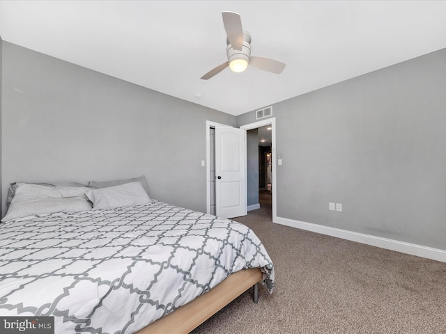 carpeted bedroom featuring a ceiling fan, baseboards, and visible vents