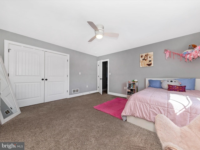 bedroom featuring visible vents, baseboards, carpet, a closet, and a ceiling fan