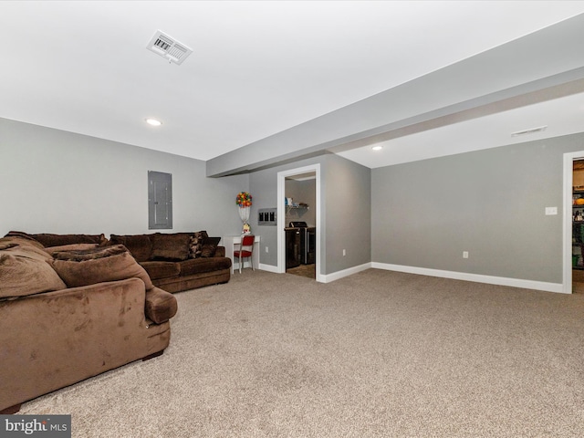 living room featuring electric panel, visible vents, carpet flooring, and baseboards