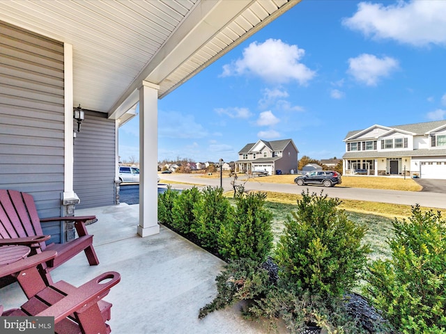 view of patio with a porch and a residential view