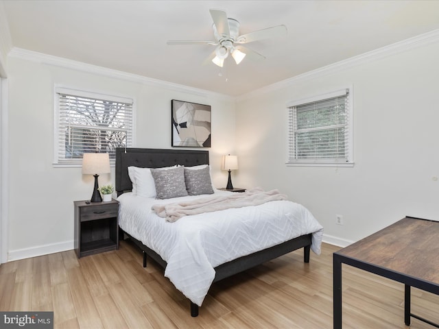 bedroom with ceiling fan, ornamental molding, wood finished floors, and baseboards