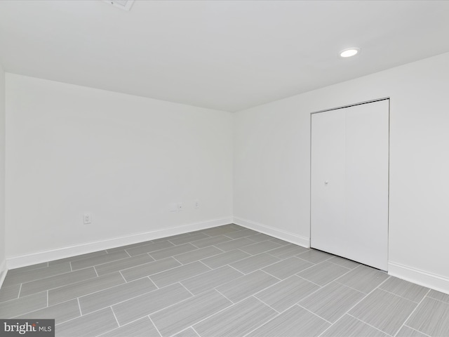 interior space featuring recessed lighting and baseboards