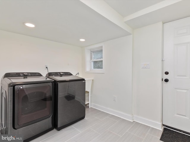 clothes washing area with laundry area, recessed lighting, washing machine and dryer, and baseboards