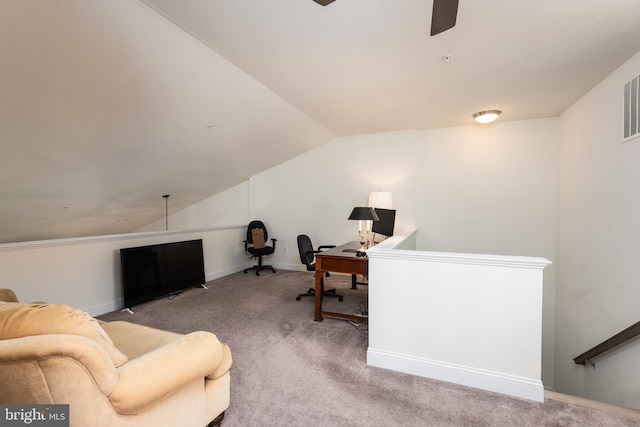 carpeted office space with a ceiling fan, lofted ceiling, and baseboards