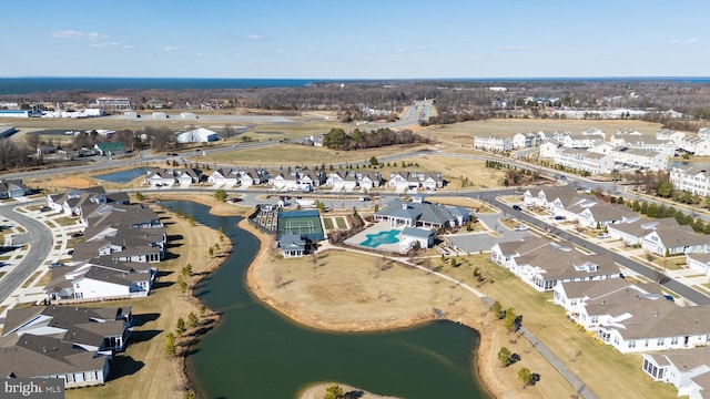 drone / aerial view with a residential view and a water view