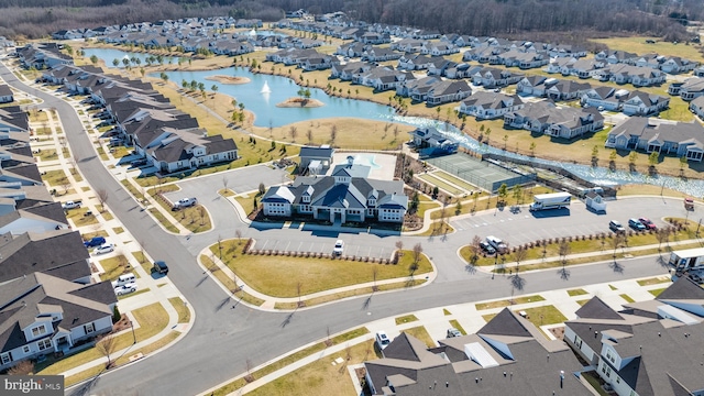 birds eye view of property featuring a water view and a residential view