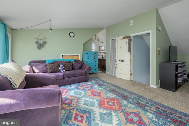 living area featuring carpet flooring and vaulted ceiling