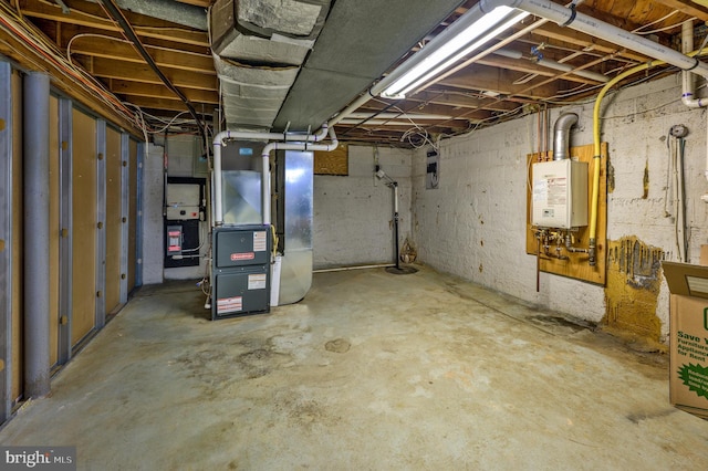 unfinished basement featuring heating unit and water heater