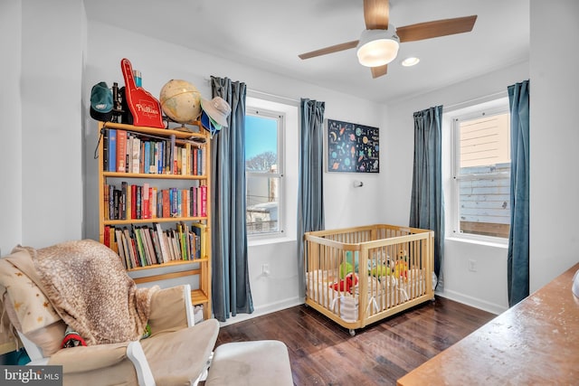 bedroom featuring a ceiling fan, recessed lighting, wood finished floors, and baseboards