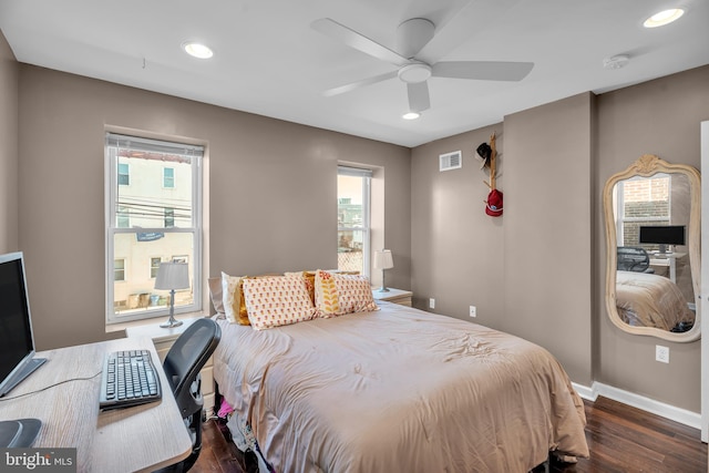 bedroom featuring recessed lighting, multiple windows, wood finished floors, and visible vents