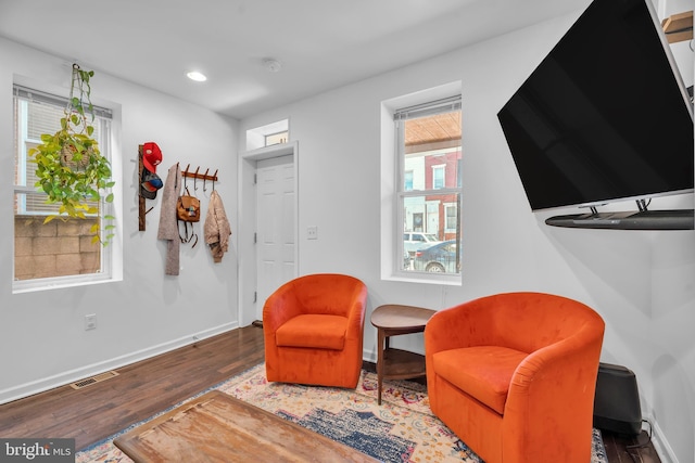 sitting room with visible vents, recessed lighting, baseboards, and wood finished floors