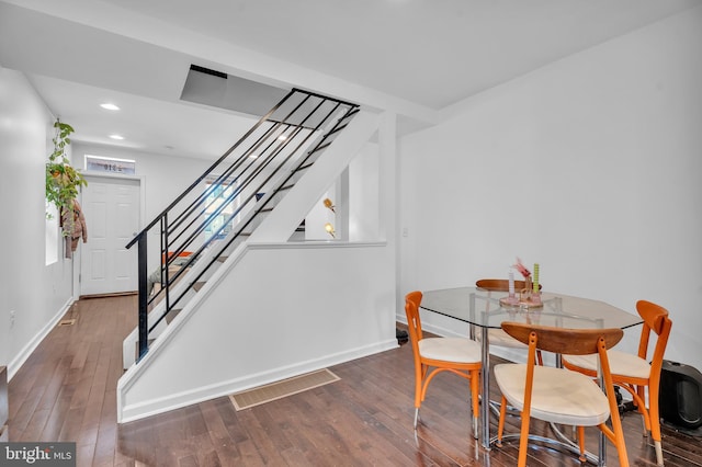 dining room with visible vents, baseboards, stairs, recessed lighting, and wood-type flooring