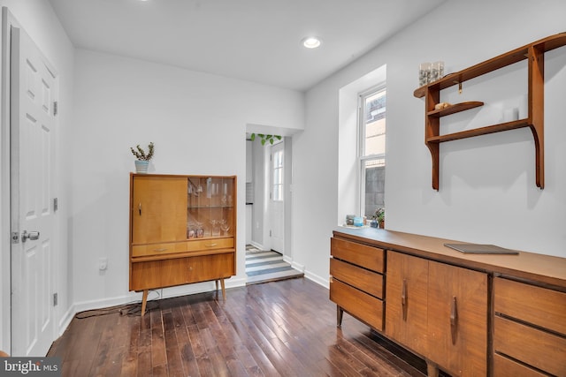 interior space with recessed lighting, baseboards, and dark wood-style flooring