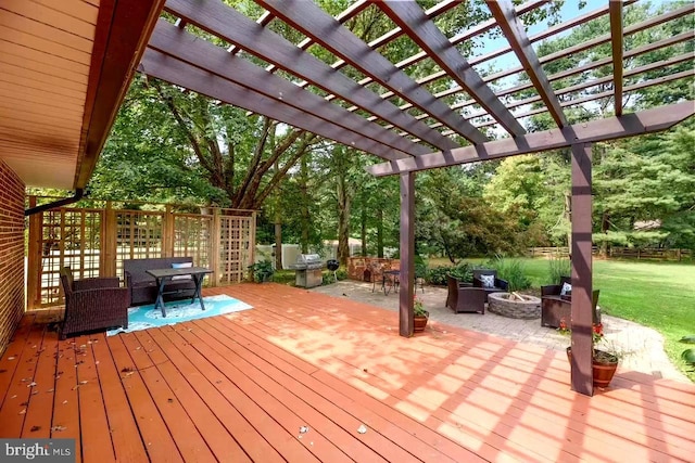 wooden deck with an outdoor fire pit and a pergola