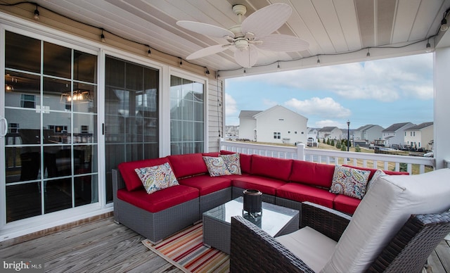 deck with a residential view, outdoor lounge area, and a ceiling fan