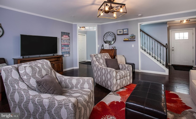 living room with stairway, baseboards, ornamental molding, and hardwood / wood-style flooring