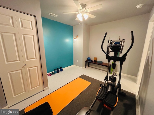 workout room with a ceiling fan, visible vents, and baseboards