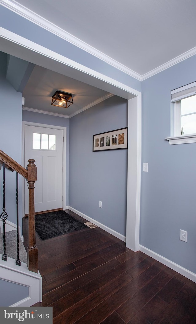 entryway featuring stairway, crown molding, and dark wood-style flooring