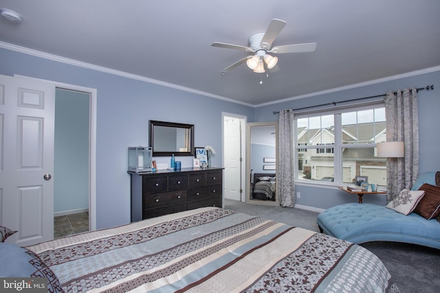 carpeted bedroom with a ceiling fan, baseboards, and ornamental molding