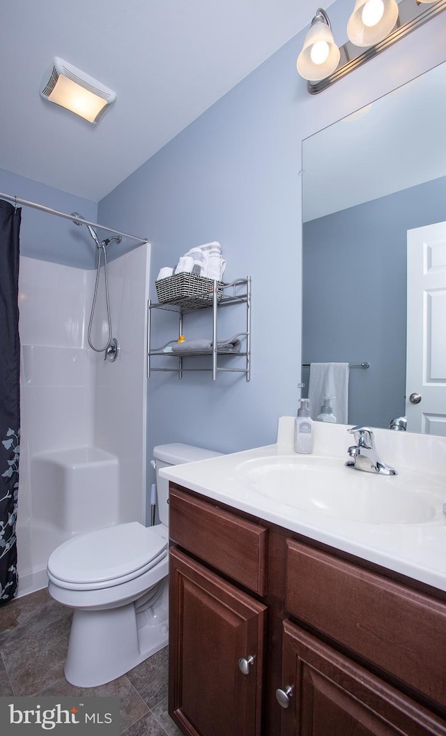 bathroom with vanity, toilet, and a shower with shower curtain