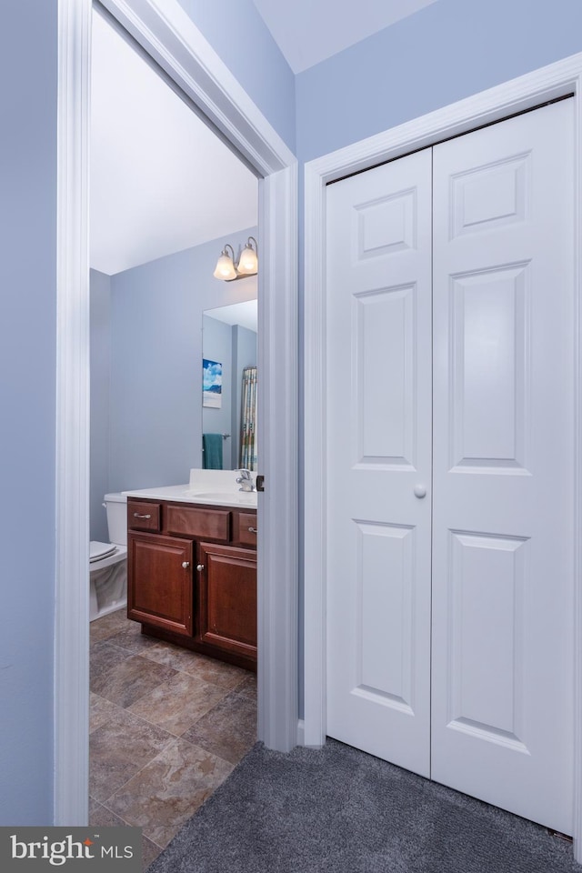 bathroom with vanity and toilet