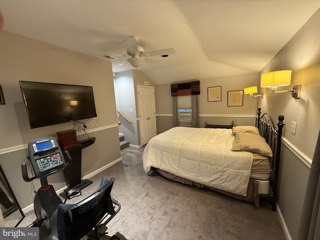 bedroom with baseboards, lofted ceiling, and carpet