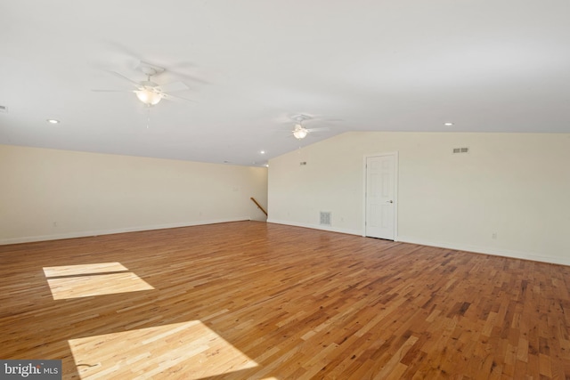 bonus room with visible vents, light wood-style flooring, vaulted ceiling, ceiling fan, and baseboards