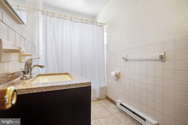 full bathroom with tile patterned floors, a shower with curtain, tile walls, a baseboard radiator, and vanity