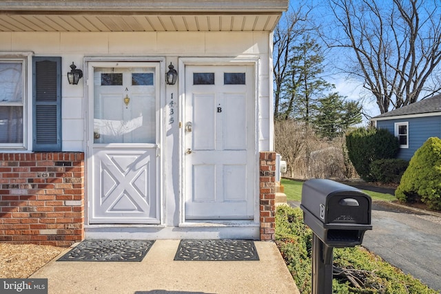 entrance to property with brick siding