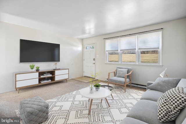 carpeted living area with baseboard heating