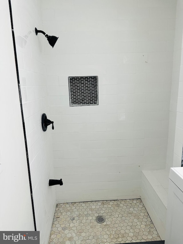 bathroom featuring a shower stall