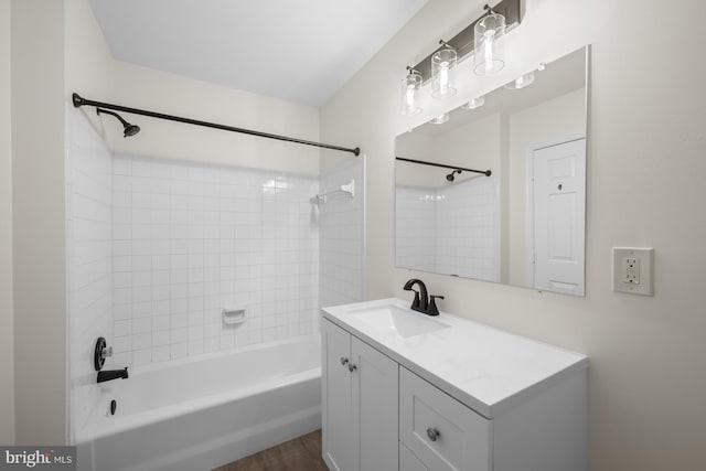 full bath with shower / tub combination, wood finished floors, and vanity