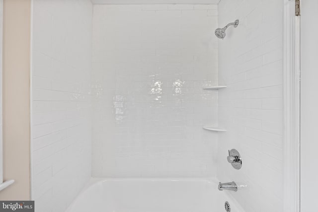 bathroom featuring  shower combination