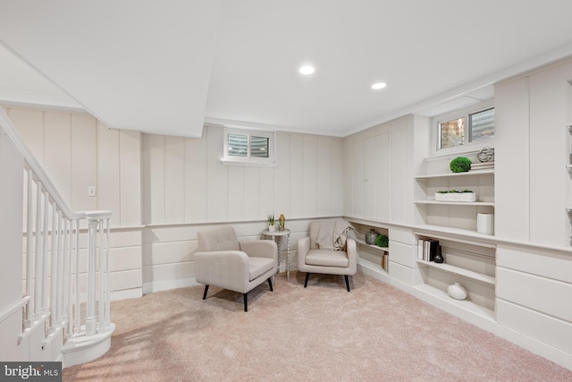 sitting room featuring carpet flooring, recessed lighting, and built in features